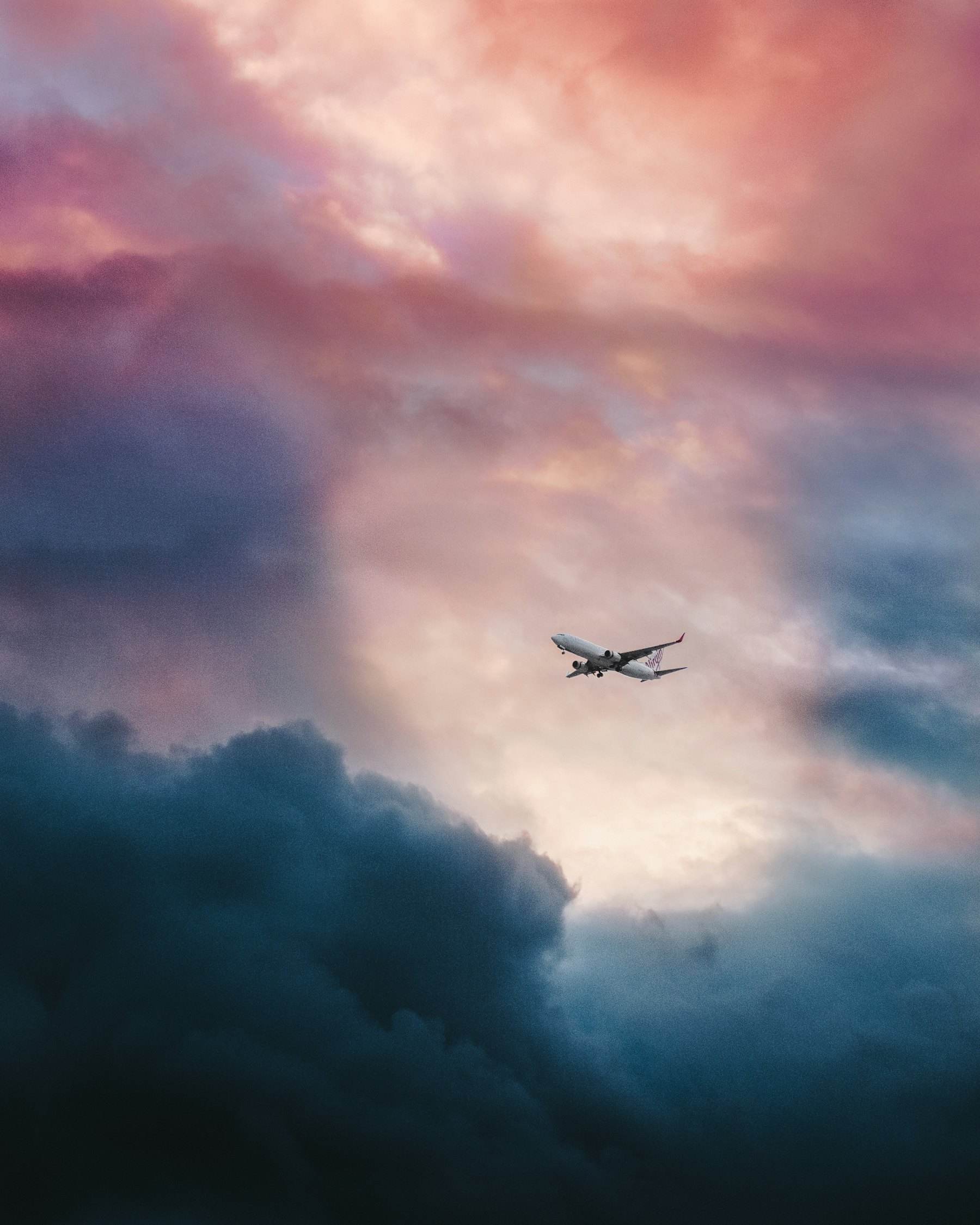Aircraft climbing through dramatic clouds